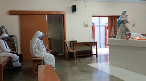 Sisters sit by Mother Teresa's Tomb