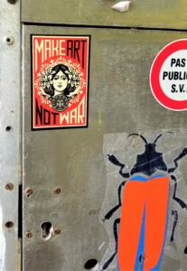 Make Art, Not War sign and Beetle graffiti in Liege, Belgium; September 2017.
